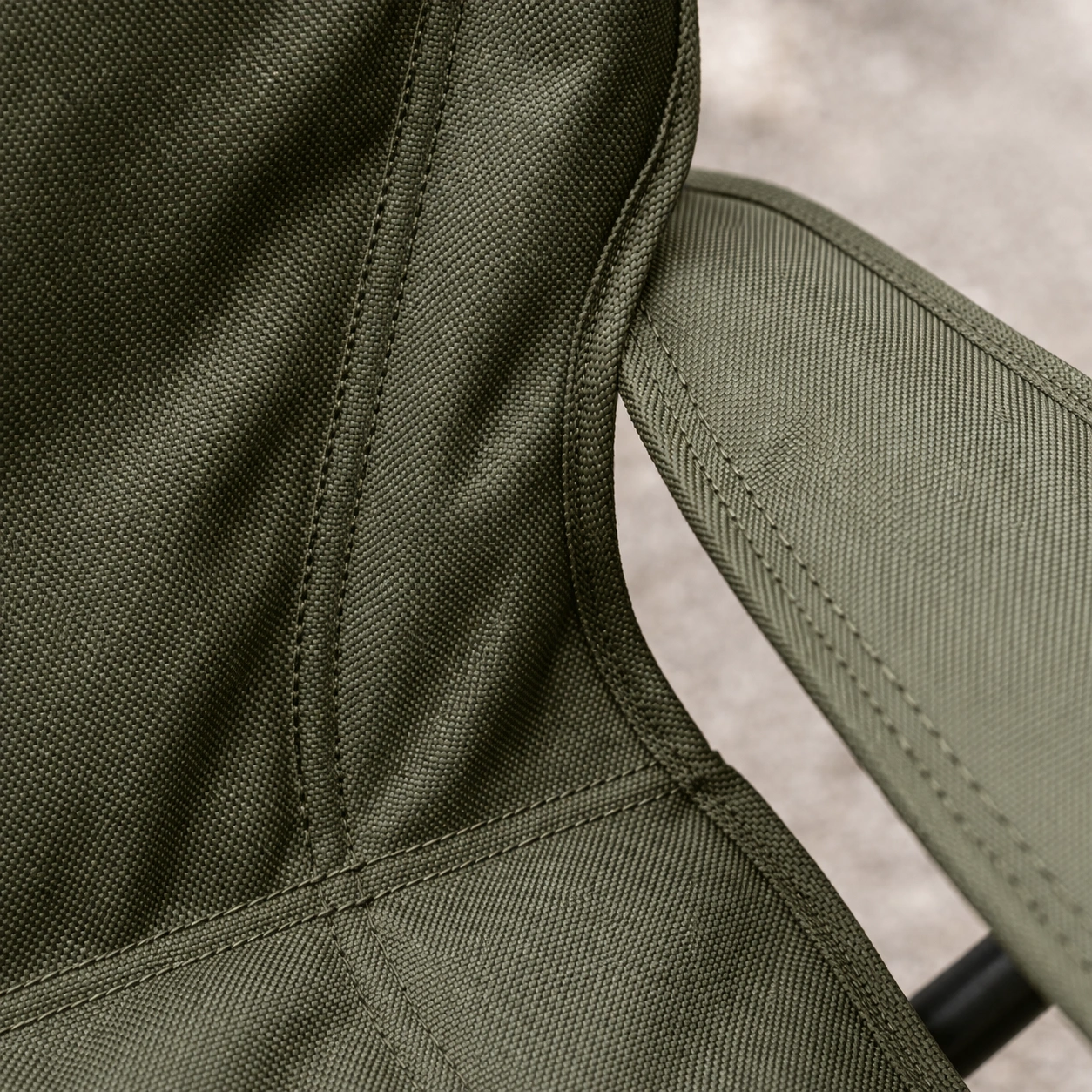 Macro texture shot of 600D polyester fabric with double-stitching seams on ALPS chair
