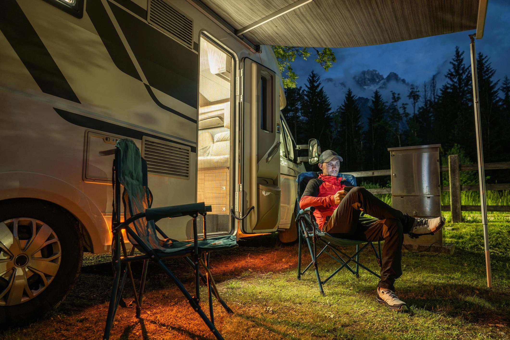 Person sleeping in reclining camping chair