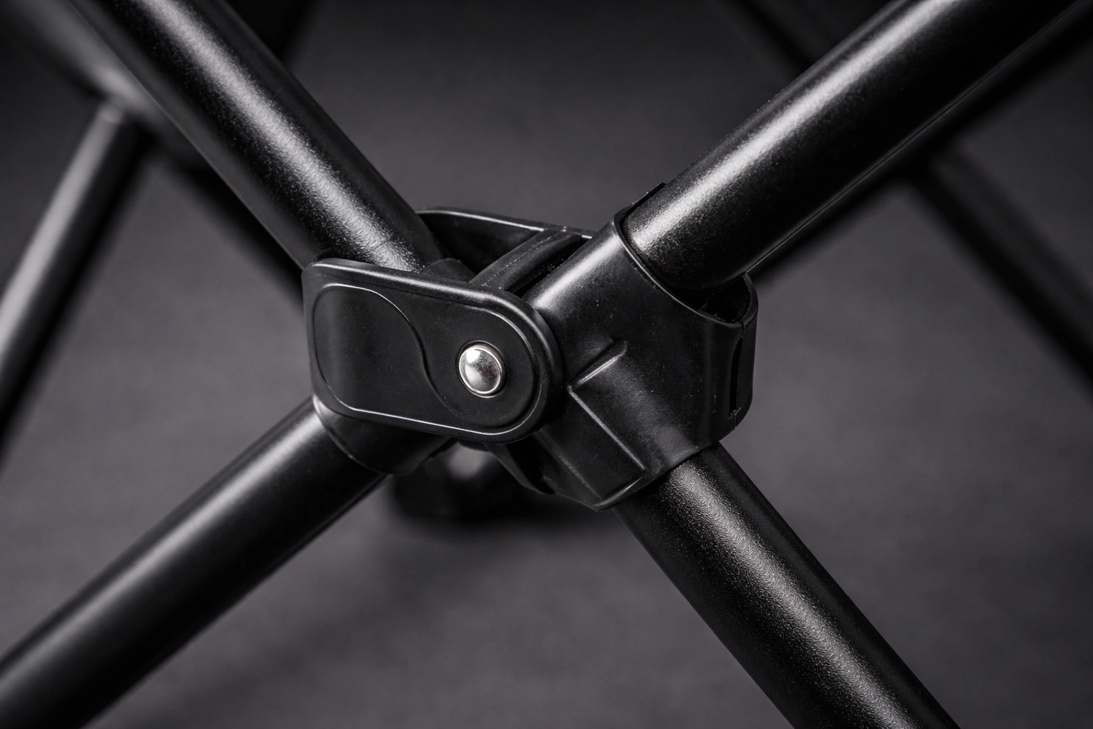 Close-up detail of Ozark Trail chair powder-coated steel frame joints and folding mechanism