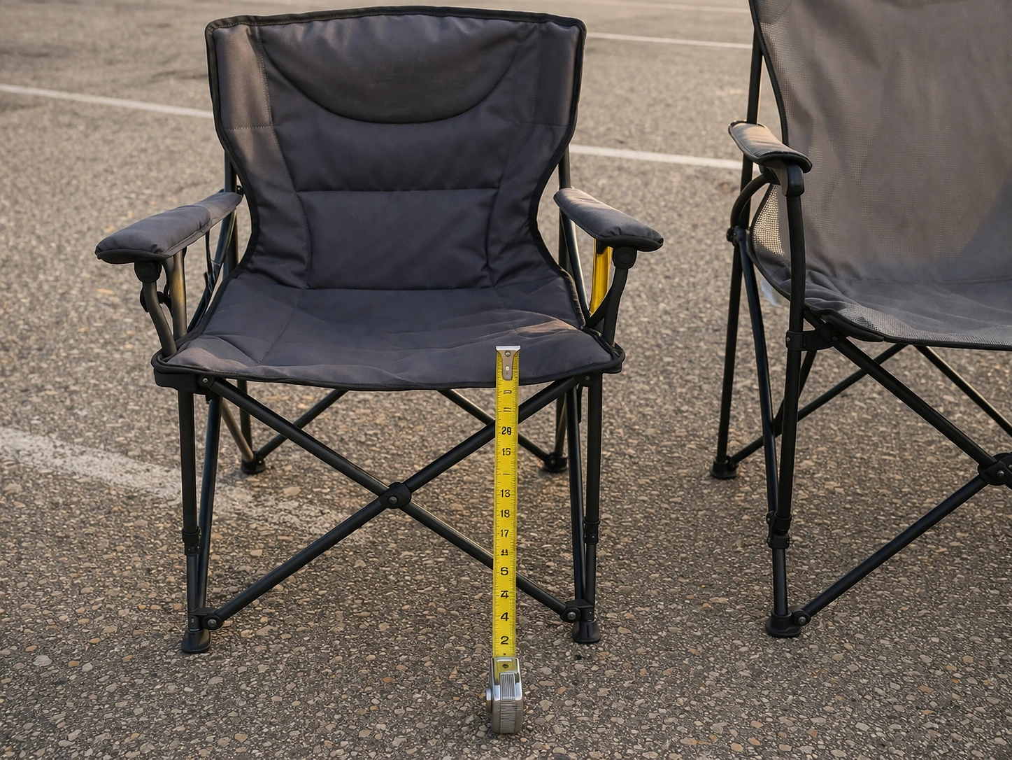 Standard-height chair on asphalt compared to taller chair for sightline rules at stadium event