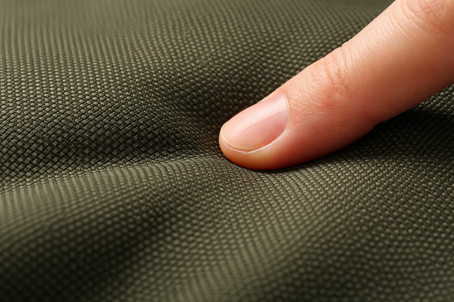 Close-up macro of thick 600D polyester fabric texture showing durability